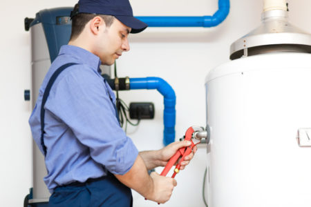 Benefits of Professional Water Heater Installation 1 Employee repairing a hot water heater