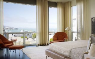 Gorgeous curtains bring an air of femininity to the bedroom