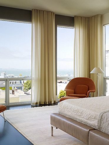 Gorgeous curtains bring an air of femininity to the bedroom