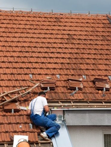 roofers working on a roof restoration 998x562 1