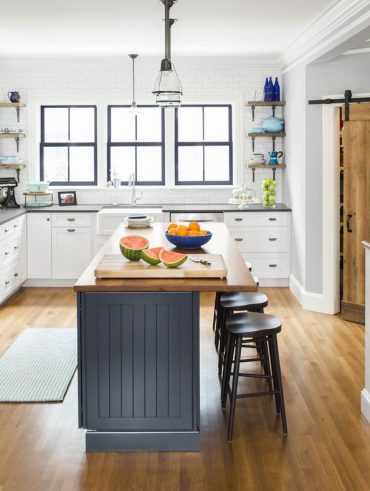 Modern kitchen with custom cabinetry and neutral tones in a Newton home.