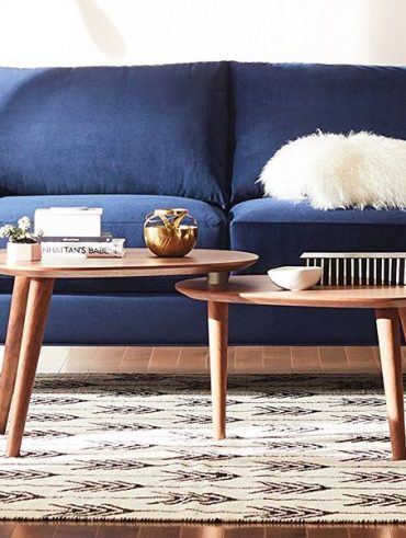 Modern Amazon Rivet sofa with mid-century style in a bright living room.