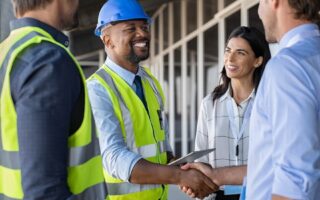 bigstock Smiling engineer shaking hands 353866670 1110x550 1